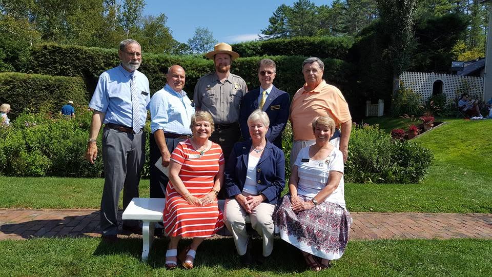 John Cloutier with community leaders and a park ranger at a garden event