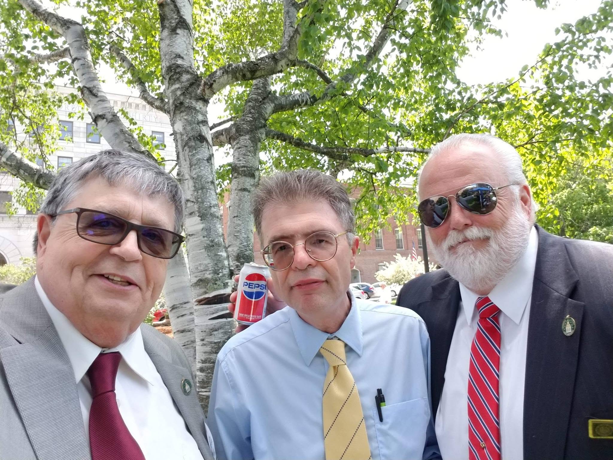 John Cloutier with two colleagues outside the New Hampshire State House in Concord